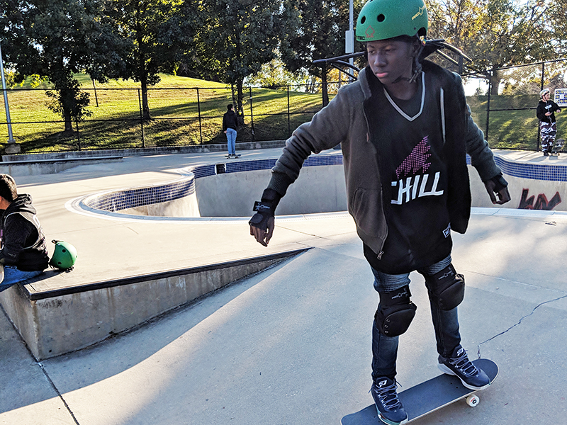 Chill youth skating at a skatepark.