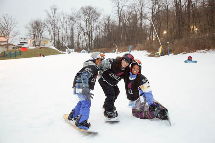 Five Chill Youth posing in the snow on the slopes