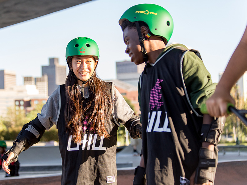 Two Chill youth smiling at skate program.