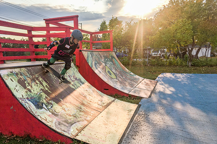 Chill youth riding a skateboard.