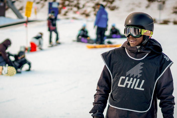 A Chill youth smiling on the slope.