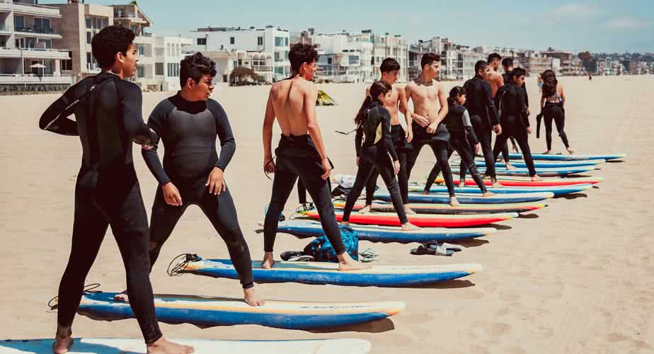Chill Surfers Practicing on Beach