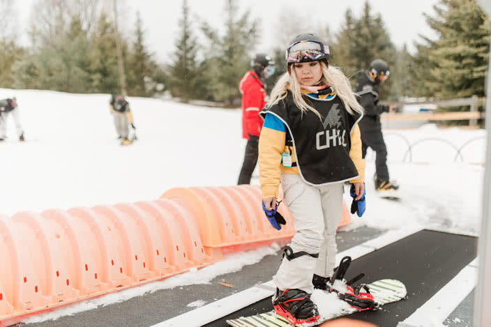 Young Chill Snowboarder at Lift