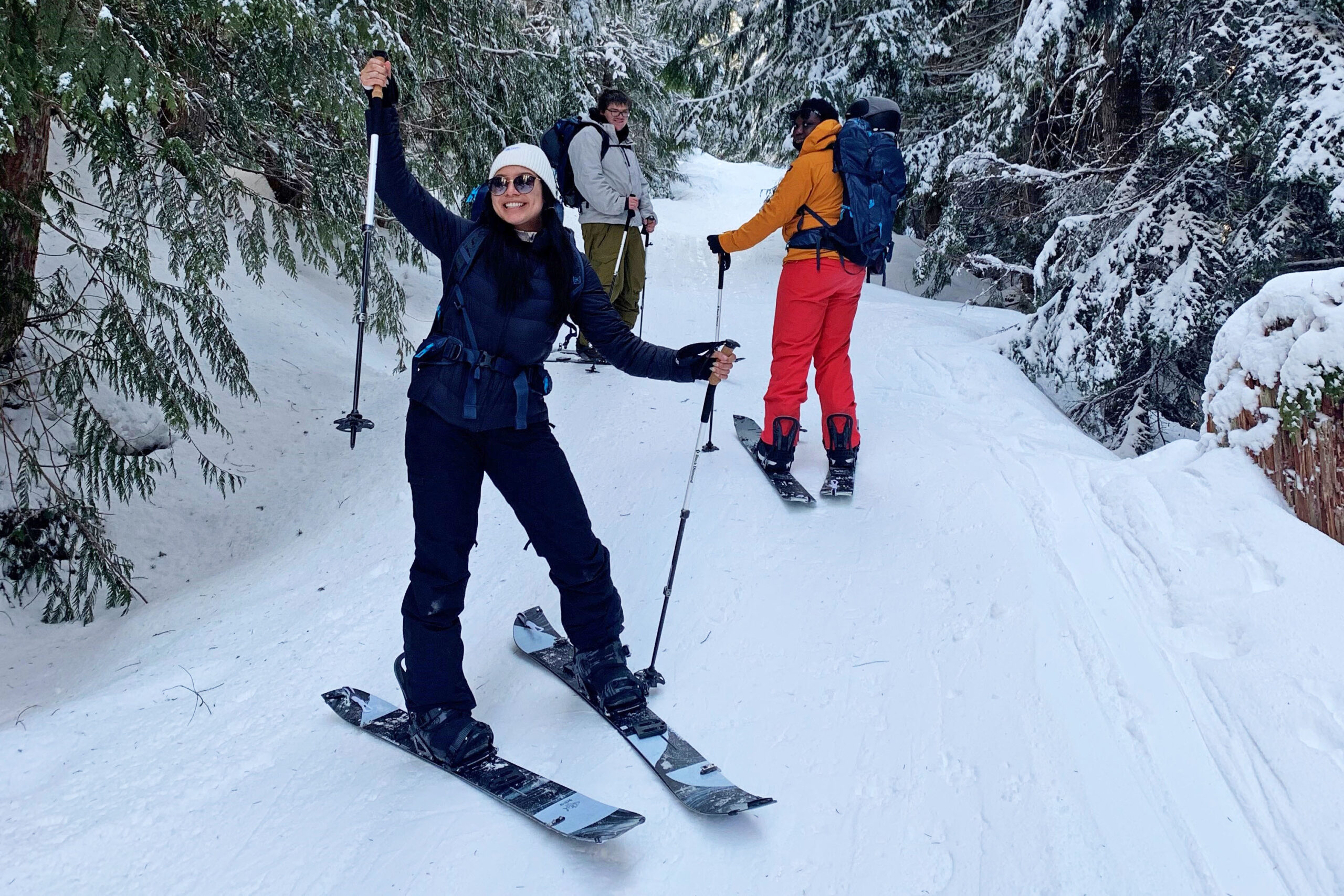 Chill youth posing for the camera while splitboarding at a Chill Explore program.