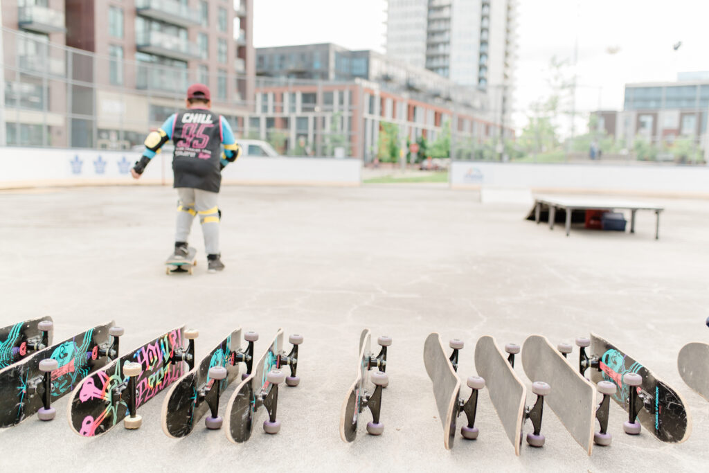 A row of skateboards waiting for Chill youth.