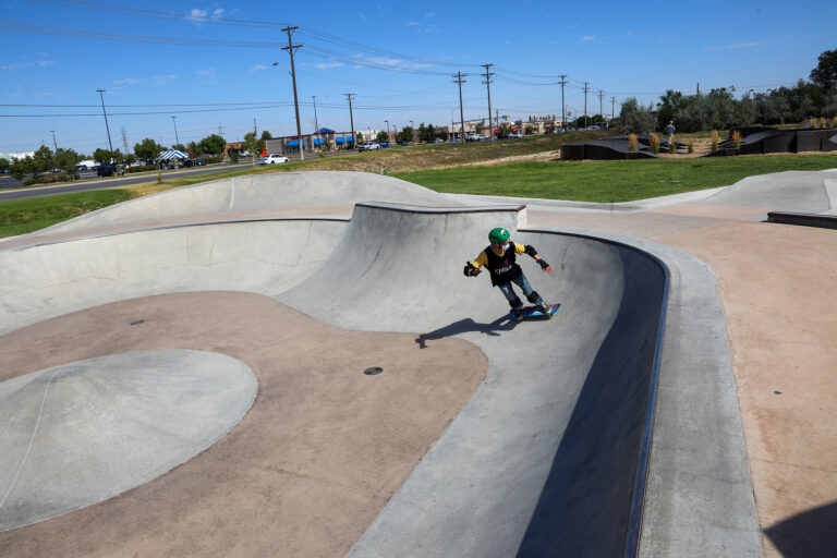 A Chill youth skating an a bowl.
